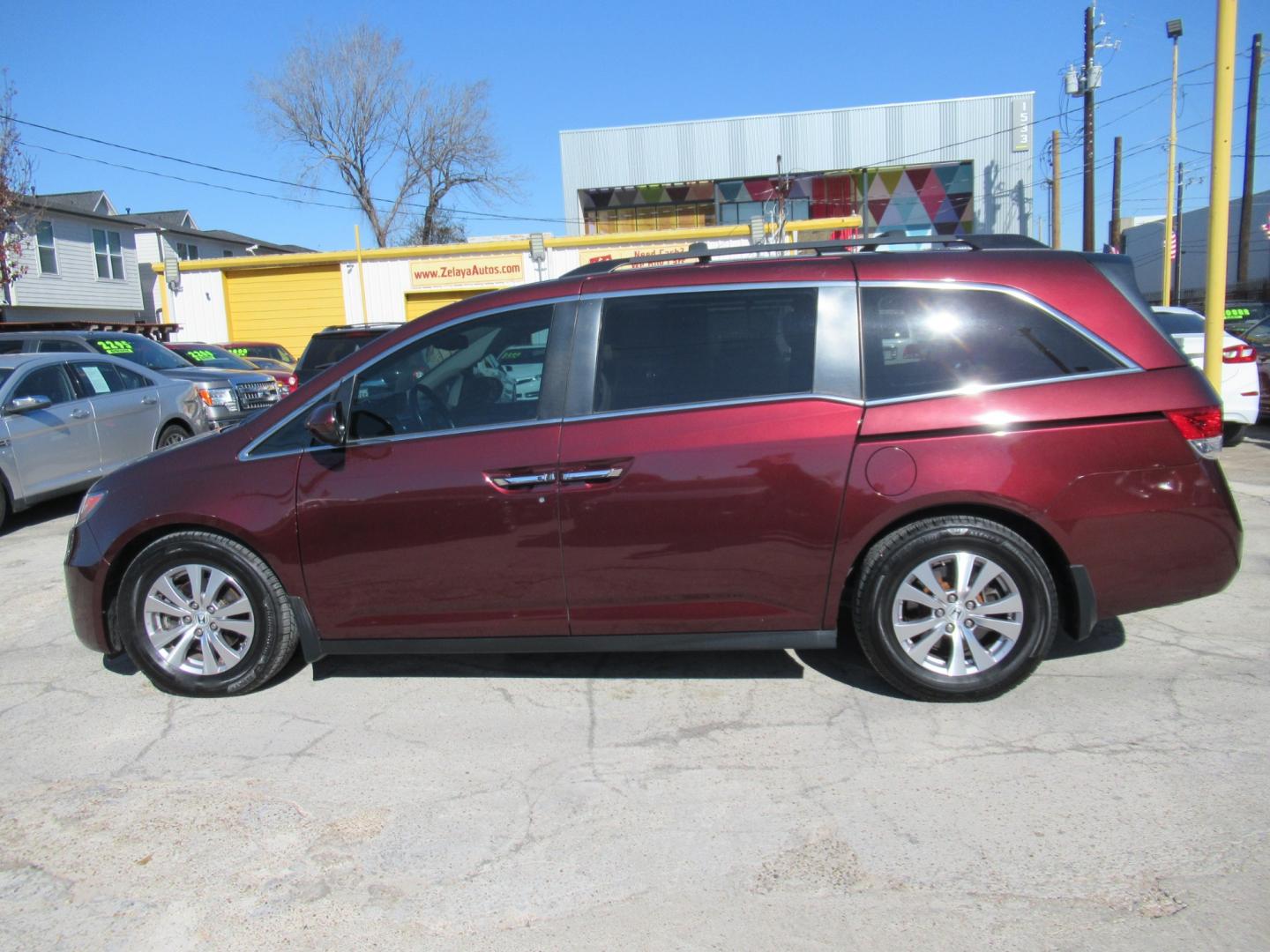 2016 Red /Tan Honda Odyssey EX-L (5FNRL5H62GB) with an 3.5L V6 SOHC 24V engine, Automatic transmission, located at 1511 North Shepherd Dr., Houston, TX, 77008, (281) 657-1221, 29.798361, -95.412560 - 2016 HONDA ODYSSEY EX-L VIN: 5FNRL5H62GB103369 5 F N R L 5 H 6 2 G B 1 0 3 3 6 9 VAN 3.5L V6 F SOHC 24V GASOLINE FRONT WHEEL DRIVE - Photo#31